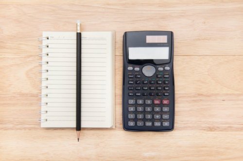 high-angle-view-of-calculator-with-notepad-and-pencil-on-table-651480447-57dc12333df78c9cce916681